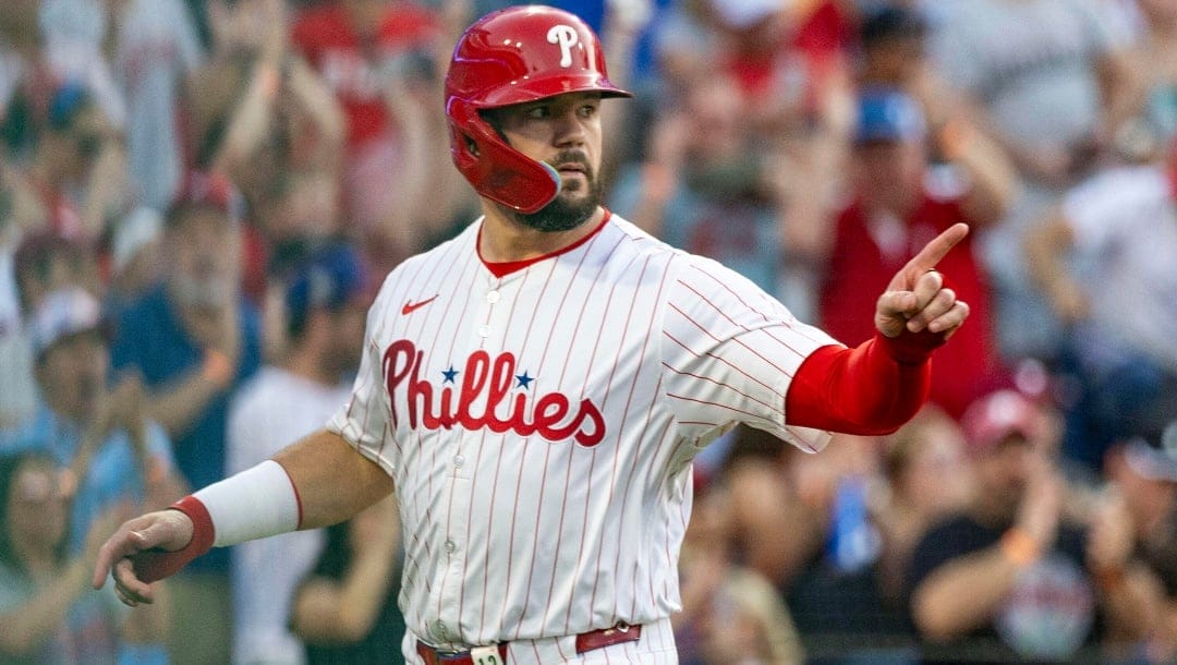 Philadelphia Phillies' Kyle Schwarber gestures at home plate after scoring on an RBI single by Nick Castellanos in the first inning of a baseball game against the New York Mets, Saturday, June 21, 2025, in Philadelphia.