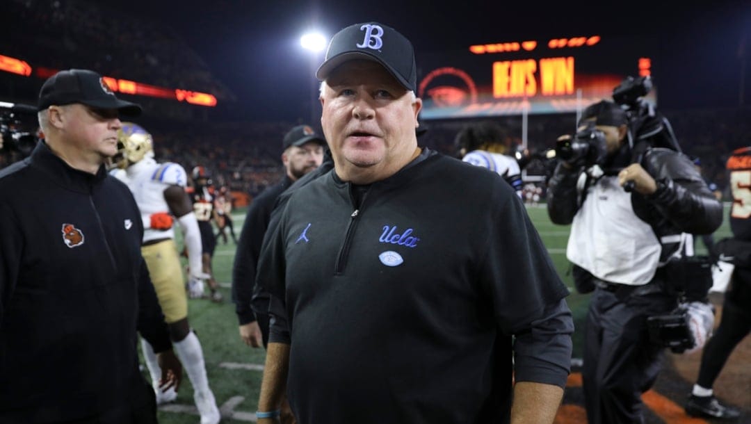 FILE - UCLA coach Chip Kelly walks off the field following the team's NCAA college football game against Oregon State, Oct. 14, 2023, in Corvallis, Ore.