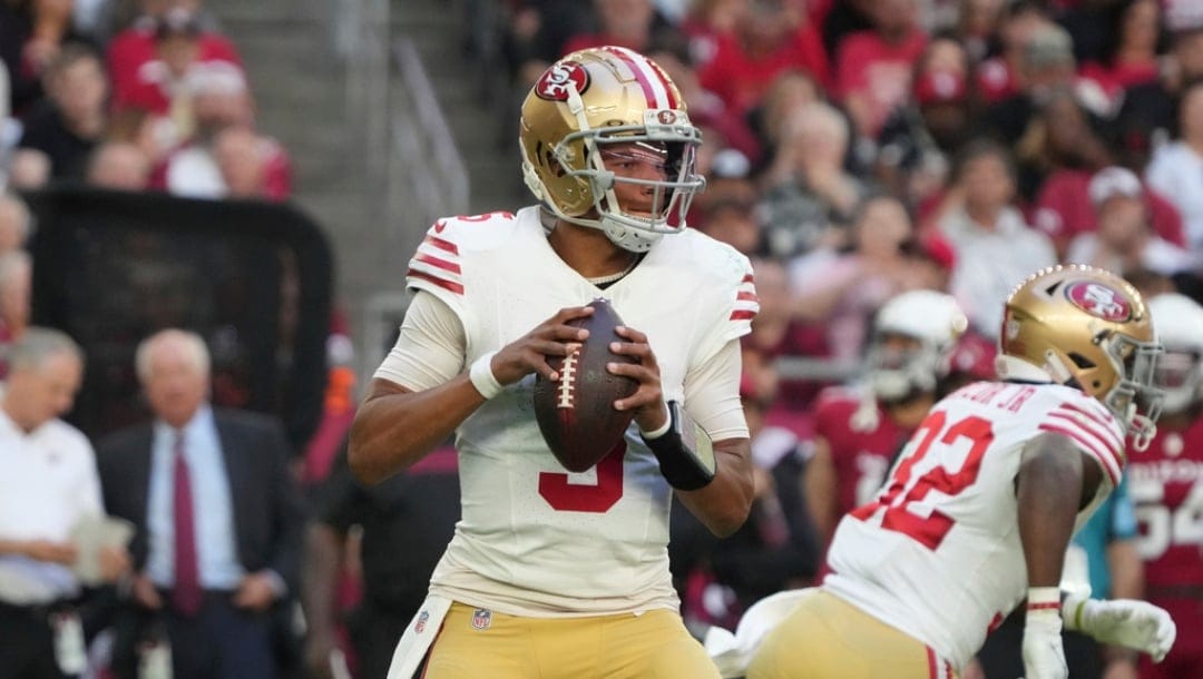 San Francisco 49ers quarterback Joshua Dobbs (5) looks to pass against the Arizona Cardinals during the first half of an NFL football game, Sunday, Jan. 5, 2025, in Glendale, Ariz.