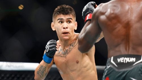 Mario Bautista, left, exchanges with Da'Mon Blackshear during a UFC 292 mixed martial arts fight, Saturday, August 19, 2023.
