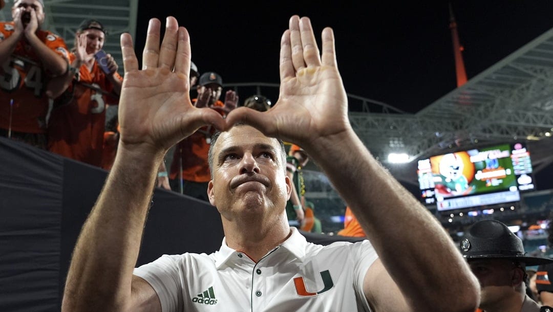 Miami head coach Mario Cristobal walks off the field after an NCAA college football game against Florida State, Saturday, Oct. 26, 2024, in Miami Gardens, Fla.
