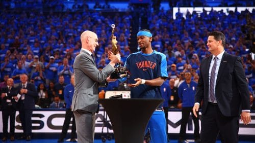 OKLAHOMA CITY, OK - MAY 22: NBA Commissioner Adam Silver presents Shai Gilgeous-Alexander #2 of the Oklahoma City Thunder with the 2024-25 Kia NBA MVP Award before the game against the Minnesota Timberwolves during Game Two of the Western Conference Finals on May 22, 2025 at Paycom Center in Oklahoma City, Oklahoma.
