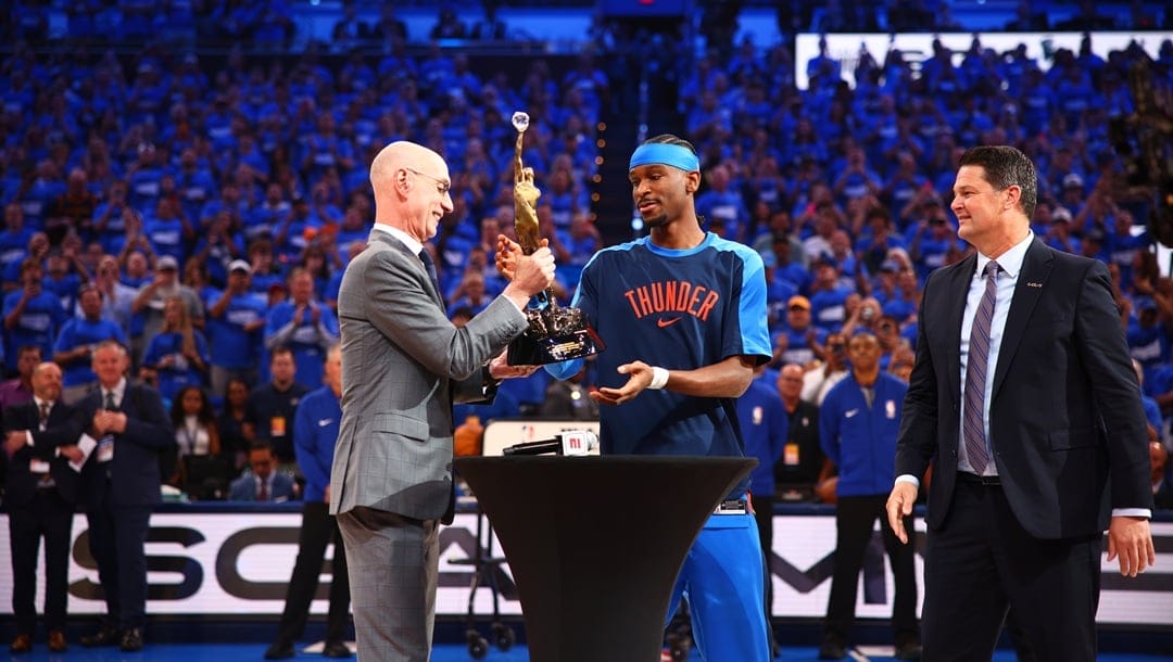 OKLAHOMA CITY, OK - MAY 22: NBA Commissioner Adam Silver presents Shai Gilgeous-Alexander #2 of the Oklahoma City Thunder with the 2024-25 Kia NBA MVP Award before the game against the Minnesota Timberwolves during Game Two of the Western Conference Finals on May 22, 2025 at Paycom Center in Oklahoma City, Oklahoma.