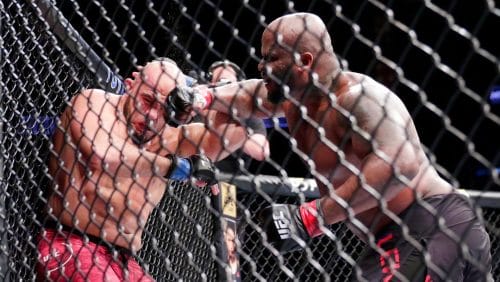 Derrick Lewis, right, hits Ilir Latifi during a heavyweight mixed martial arts bout at UFC 247 on Saturday, Feb. 8, 2020.