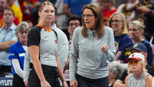 Indiana Fever head coach Stephanie White, right, talks with referee Jenna Reneau in the second half of a WNBA basketball game against the Connecticut Sun in Indianapolis, Tuesday, June 17, 2025.