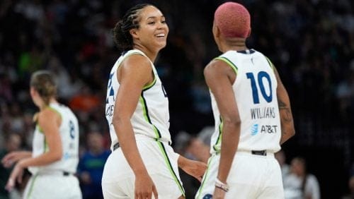 Minnesota Lynx forward Napheesa Collier, center left, and guard Courtney Williams (10) react during the second half of a WNBA basketball game against the Chicago Sky Tuesday, July 22, 2025, in Minneapolis.