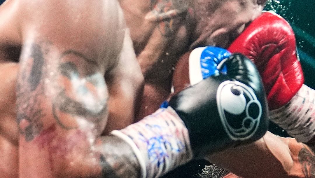 Manny Pacquiao, right, fights Mario Barrios in a welterweight title boxing match Saturday, July 19, 2025, in Las Vegas.